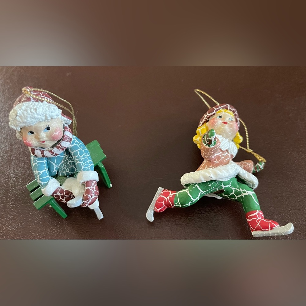 Pair of kids ice skating ornaments.